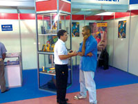 Gary Casper of Comtest talks to a visitor to the Angolan FILDA trade show